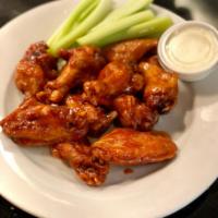 CHICKEN WINGS · Served with Celery, Blue cheese & toasted Bread. For every 10 wings there will be 1 cup of b...
