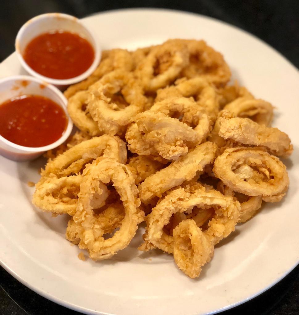 FRIED CALAMARI · Generous portion battered and dipped in our delicious bread crumbs and fried to perfection. Served with Marinara sauce on the side. Fresh calamari delivered daily.