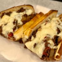 PHILLY CHEESE STEAK SANDWICH · Shredded top sirloin sautéed on flat top with mushrooms, onions, peppers & mozzarella.