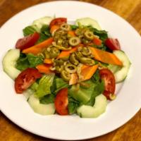 GARDEN SALAD · ROMAINE LETTUCE , CUCUMBERS, TOMATOES, CARROTS, GREEN OLIVES. SERVED WITH BREAD AND DRESSING...