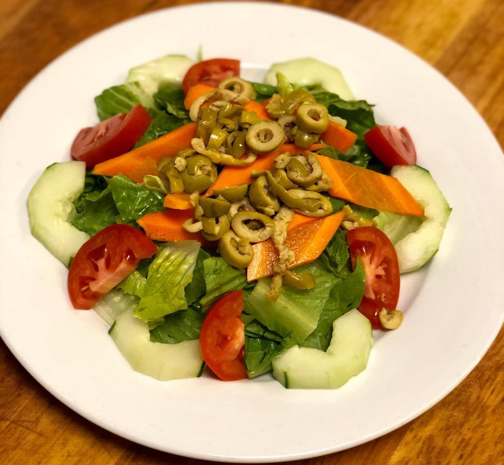 GARDEN SALAD · ROMAINE LETTUCE , CUCUMBERS, TOMATOES, CARROTS, GREEN OLIVES. SERVED WITH BREAD AND DRESSING ON THE SIDE.
**CAN ADD GRILLED CHICKEN, BREADED CHICKEN, SHRIMP & MORE ON TOP**