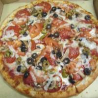 Manhattan Pizza · Pepperoni, mushrooms, black olives, green olives, tomatoes, garlic sauce and mozzarella chee...