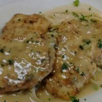 Chicken Francese Pasta · Egg-battered chicken breast sauteed with lemon butter and white wine sauce and served over l...