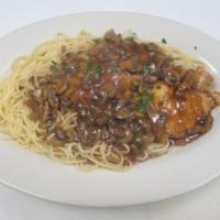 Chicken Marsala Pasta · 2 tender chicken breasts sauteed with fresh mushrooms in a Marsala wine sauce served over sp...