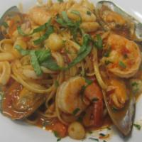 Linguini di Mare · Shrimp, scallops, calamari, mussels tossed with linguine in a spicy red or white sauce. Fres...