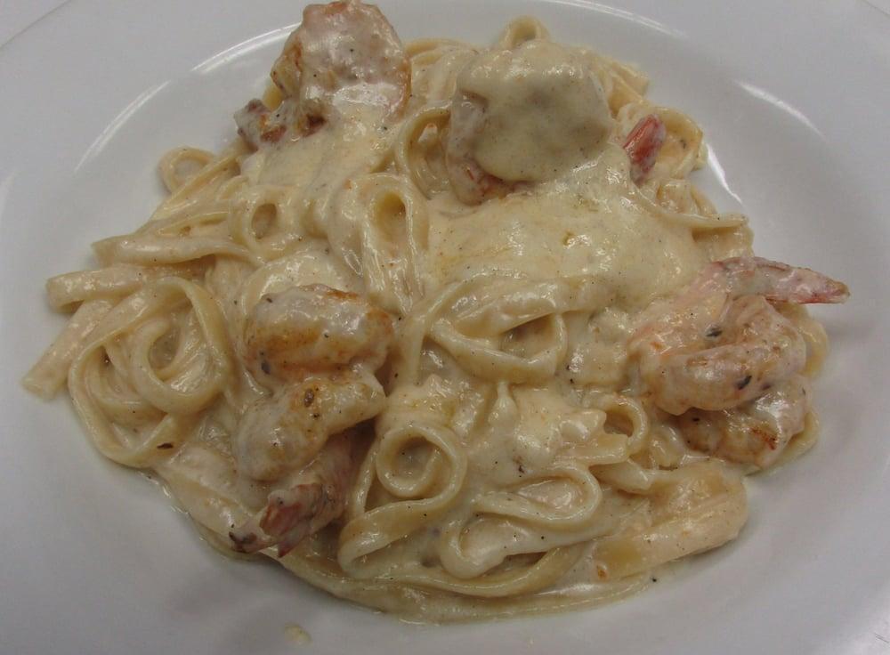 Shrimp Fettuccine Alfredo · Fresh pastas includes small house salad and garlic bread.