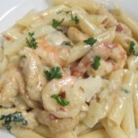 Penne Rustica · Sauteed shrimp, prosciutto and chicken tossed with Alfredo sauce. Fresh pastas includes smal...