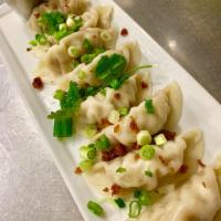 Steamed Chicken Dumpling · Homemade steamed dumplings loaded with chicken and vegetables.