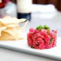 Tuna Tartare · Finely diced fresh ahi tuna with Thai spicy sauce and crispy wontons.