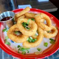 Fire Fried Calamari · Lightly battered fried calamari with green onion and sweet and sour sauce.
