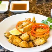 Fish Pakora · Skinless and boneless fillets of Swai dipped in chickpea batter Blended with House Spice mix...