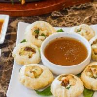 Pani Puri Gol Gappe · Round, hollow puri, fried crisp and served with a mixture of flavored water (commonly known ...