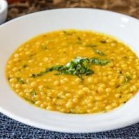Chana Daal · Chickpea lentils cooked with garlic and ginger with other herbs. Vegetarian.