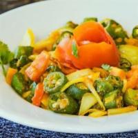 Bhindi Masala · Fried okra flavored with special masala mix, coriander, chiles, and onions in north Indian r...