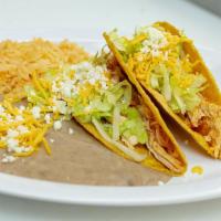Combo #2 Two Beef or Chicken Tacos · 2 shredded beef, chicken or ground beef hardshell tacos with lettuce and cheese.