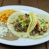 Combo#6 Two Soft Tacos · Choice of Carne Asada(pictured) Grilled Chicken, Carnitas, Adobada, Lengua, Cabeza or Fish.
