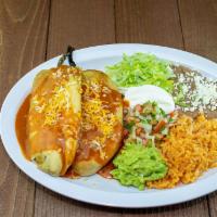 Combo#9 Two Tamales or Two Chiles Rellenos · Two tamales chicken or beef with enchilada sauce, sour cream, lettuce and cheese on top. or ...