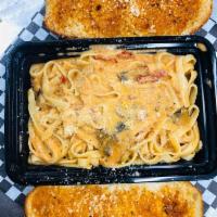 Pasta with Pink Sauce · Served with garlic bread.