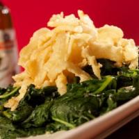 Lemon Garlic Spinach · Topped with crispy fried onions. Served with steamed rice. Vegetarian.