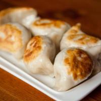 A25. Beef Dumplings · Pan seared and served with chef's spicy sauce.
