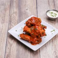 Chicken Wings · Your choice of sauce. Cooked wing of a chicken coated in sauce or seasoning.