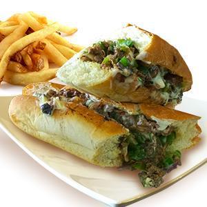 Philly Cheesesteak Sandwich · Thinly sliced skirt steak with grilled onions, mushrooms, bell peppers, melted cheese and mayo. Served with a side of French fries.