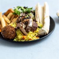 Shawarma Dinner Plate · Served with pita bread, rice, tahini sauce, hummus or babaghanoush and salad or fries.