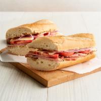 Carved Ham & Swiss Sandwich · Pecan wood smoked ham, Swiss cheese, tomato, red onion, stoneground mustard, and baguette.
