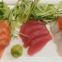 Sashimi Deluxe · Fifteen pieces of sashimi and white rice. Served with garden salad or miso soup.