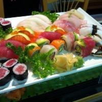 Sushi for 2 · Eighteen pieces of sushi, one tuna roll and one rainbow roll. Served with garden salad or mi...