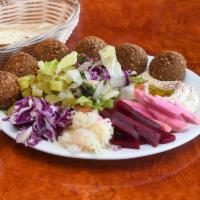 3. Falafel Plate · 6 falafels, hummus, lettuce, tomato, Jerusalem salad, turnip, beets, cucumber pickles, sauer...