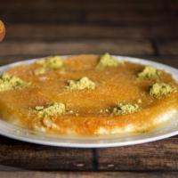 60. Planet's Kenafeh · The most famous dessert in Middle East made from shredded filo dough, sweetened cheese filli...
