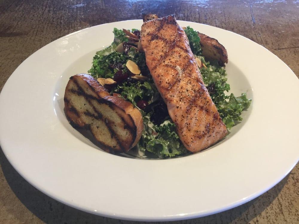 Organic Beet and Salmon Salad · Mixed greens, cherry tomatoes, oven roasted golden & red beets, toasted almonds, topped with goat cheese and a crostini. Balsamic vinaigrette on side.