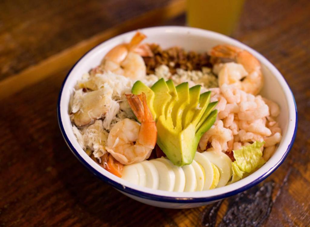 Ocean Cobb Salad · Prawns, crab, Bay shrimp, bacon, avocado, egg, bleu cheese crumbles with balsamic vinaigrette.