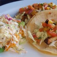 Grilled Mahi Mahi Tacos (3) · Chipotle aioli cabbage and tropical salsa & served with black beans & lime cilantro rice