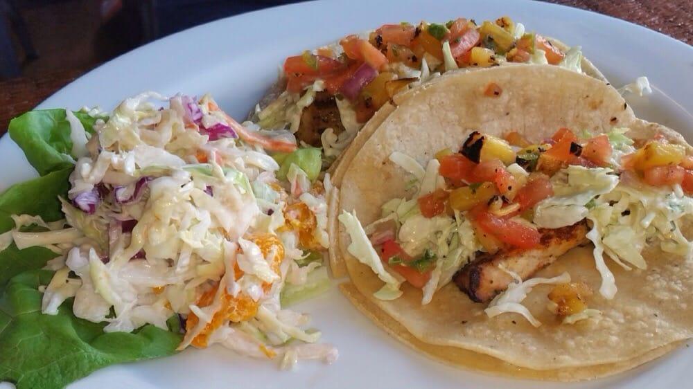 Grilled Mahi Mahi Tacos (3) · Chipotle aioli cabbage and tropical salsa & served with black beans & lime cilantro rice