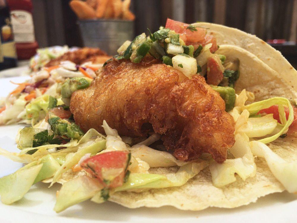 (3) Cod Tacos · Crispy cod, chipotle aioli cabbage and avocado salsa served with lime cilantro rice & black beans