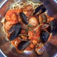 Cioppino · Salmon, mahi mahi, prawns, scallops, cod, clams, mussels and pasta in a savory herb sauce se...
