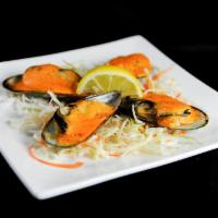 Green Mussels · 4 pieces baked with spicy mayo.