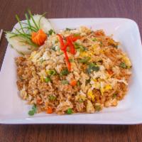 Crab Fried Rice · Stir-fried rice with crab meat, onion, carrots, green peas and egg.