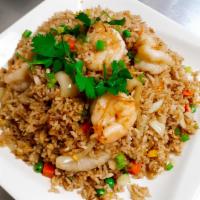 Thai Fried Rice · Stir-fried rice with onion, carrot, green peas, egg and your choice of meat.