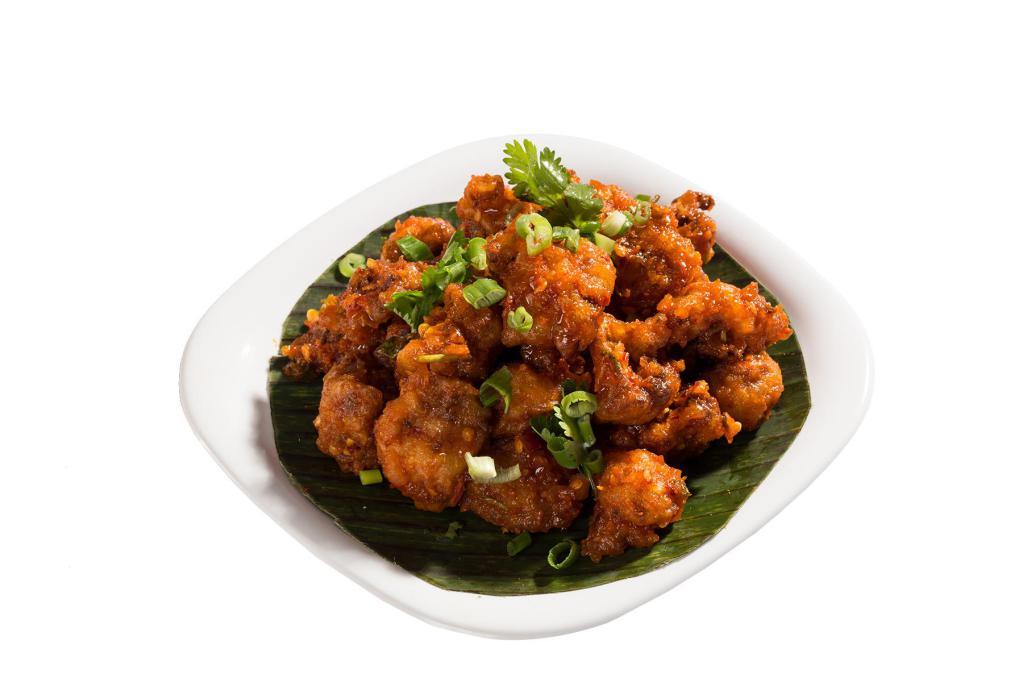 Gobi Manchuria · Wet. Marinated deep-fried cauliflower cooked with thick Manchurian gravy. Served with rice.