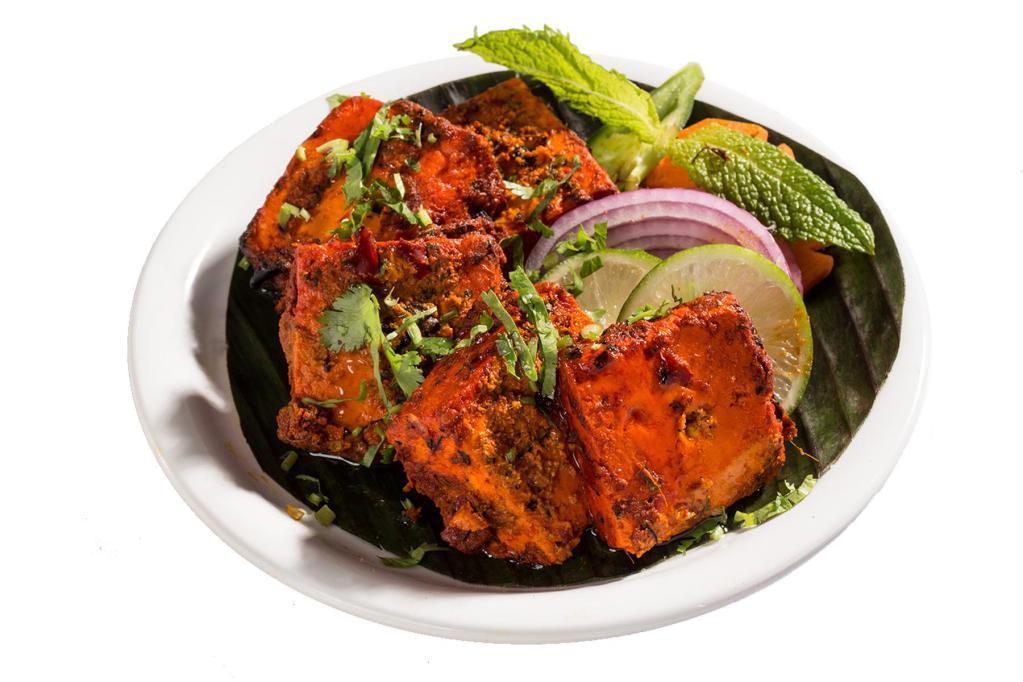 Paneer Tikka Kabob · Cheese cubes and onions marinated in a spicy sauce.