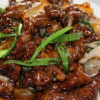 38. Mongolian Beef · Beef with onions, scallions, in mongolian grill sauce. With a side of rice. Spicy.