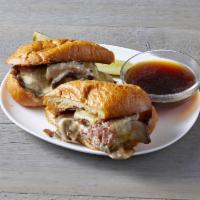 Classic French Dip · Roast beef, Swiss cheese, au jus, and grilled French baguette.