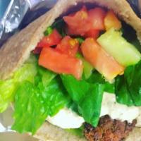  Baked Falafel Hummus Sandwich (Vegetarian) · Whole wheat pita with home-made hummus, baked falafel, romaine, tomato and cucumber. Vegetar...
