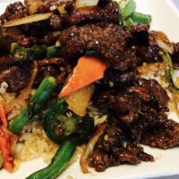 Mongolian Beef Plate · Sliced tender beef seared with onions, scallions in special Mongolian sauce.