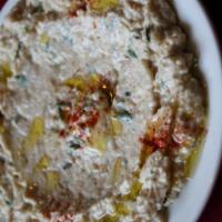 Baba Ghanouj · Roasted eggplant mashed and mixed with tahini, garlic and various herbs and spices.