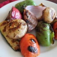 Grilled Veggie Delight · Grilled mushroom, zucchini, green peppers, tomatoes, and onion served with hummus and pita b...