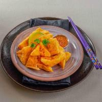 Golden Triangles · Famous Bangkok street vendor offer this crispy fried soft bean curd. Served with spicy crush...